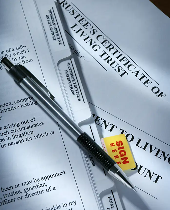 NFA gun trust paperwork with pen